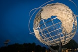 low angle photo of Earth metal statue