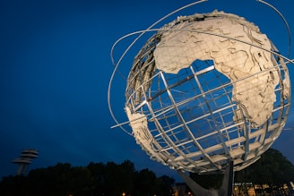 low angle photo of Earth metal statue