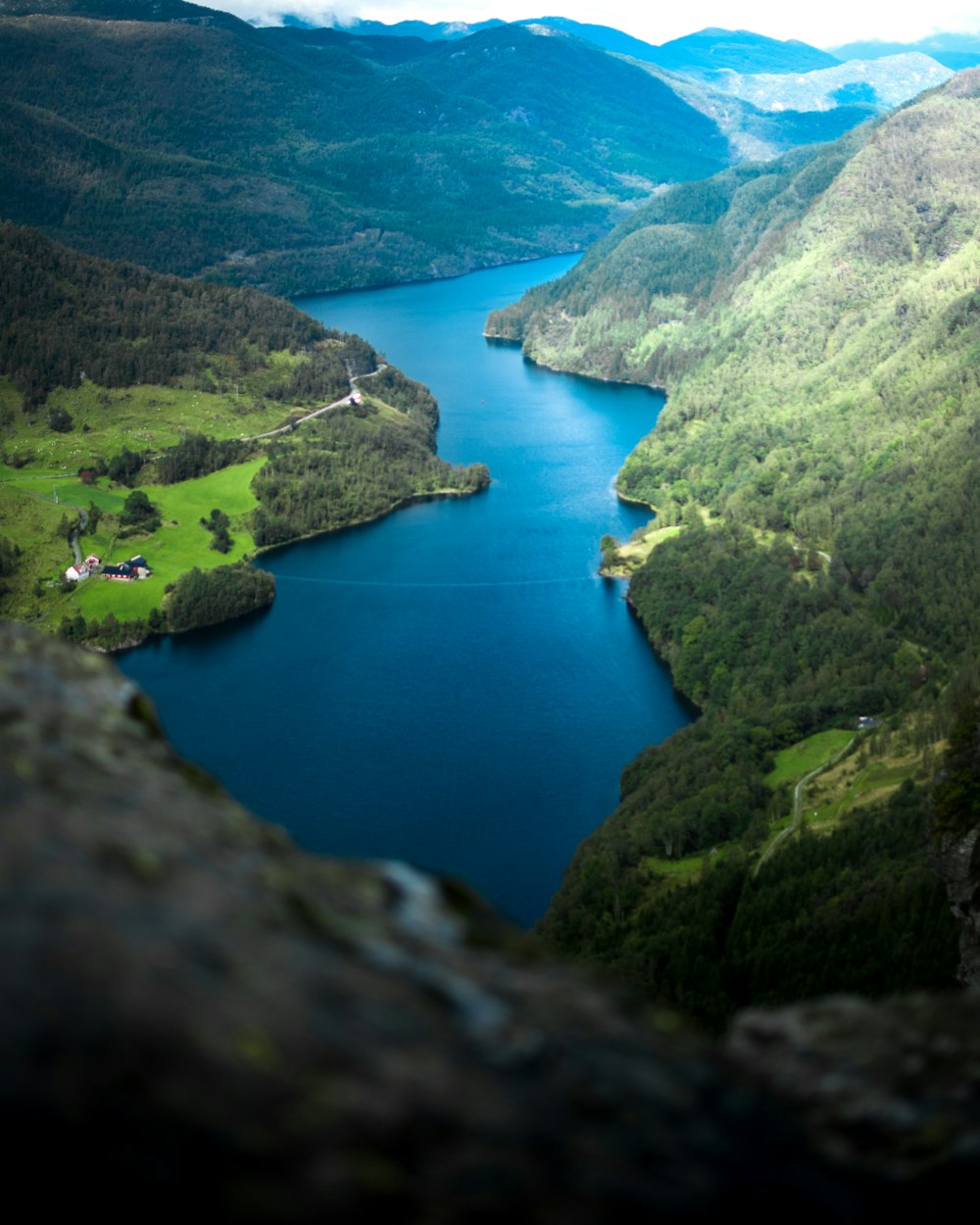 aerial view of mountain near body of water