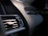 Close-up of a car dashboard showing a cool, refreshed air conditioning vent.