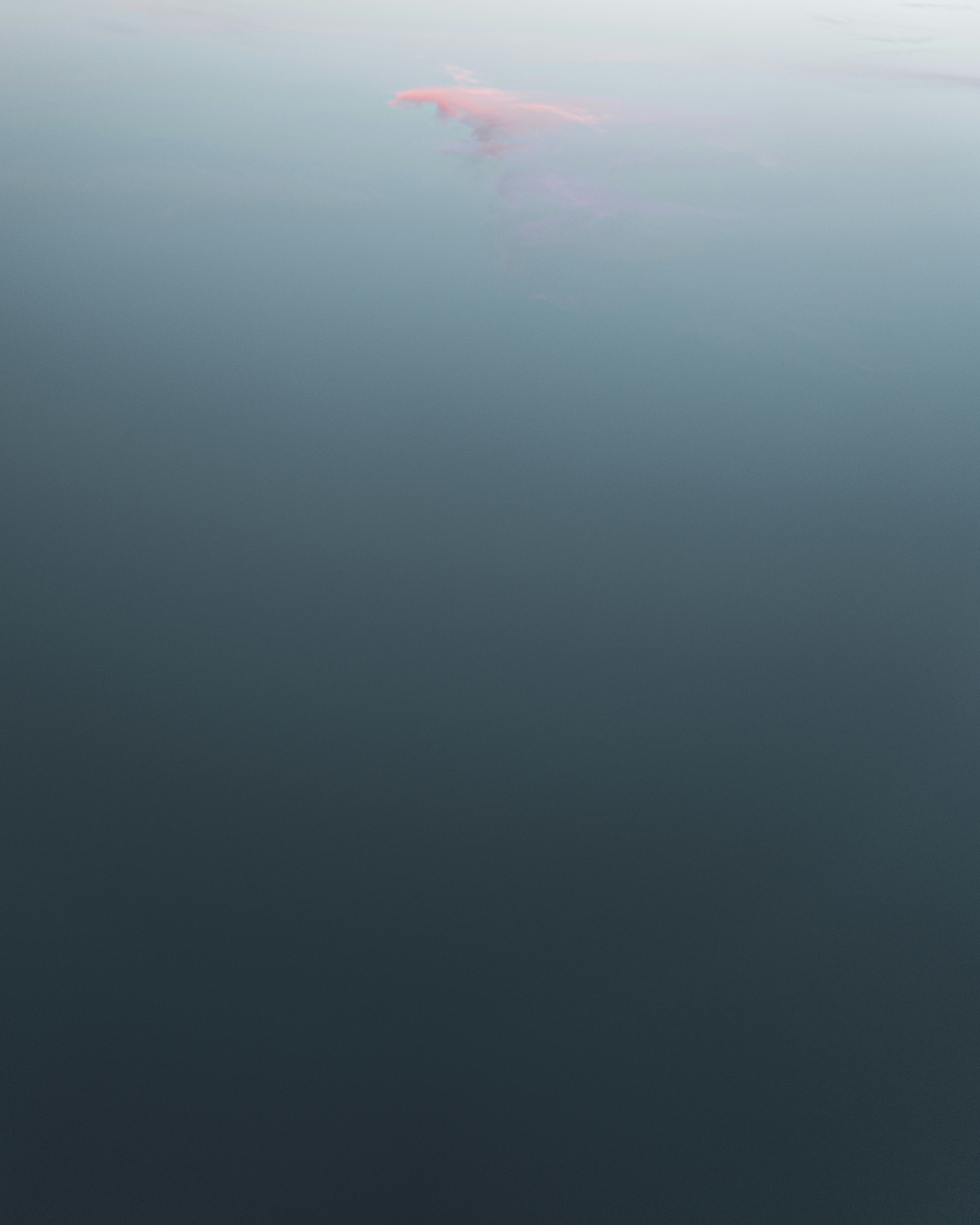 a large body of water with a red object in the middle of it