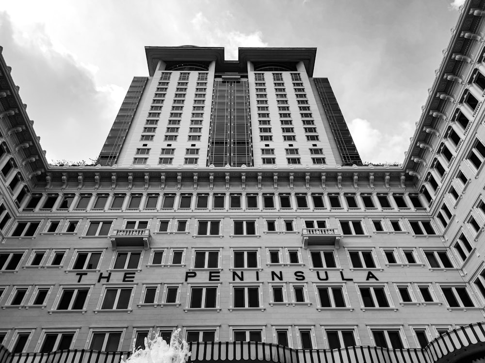 grayscale photography of The Peninsula building