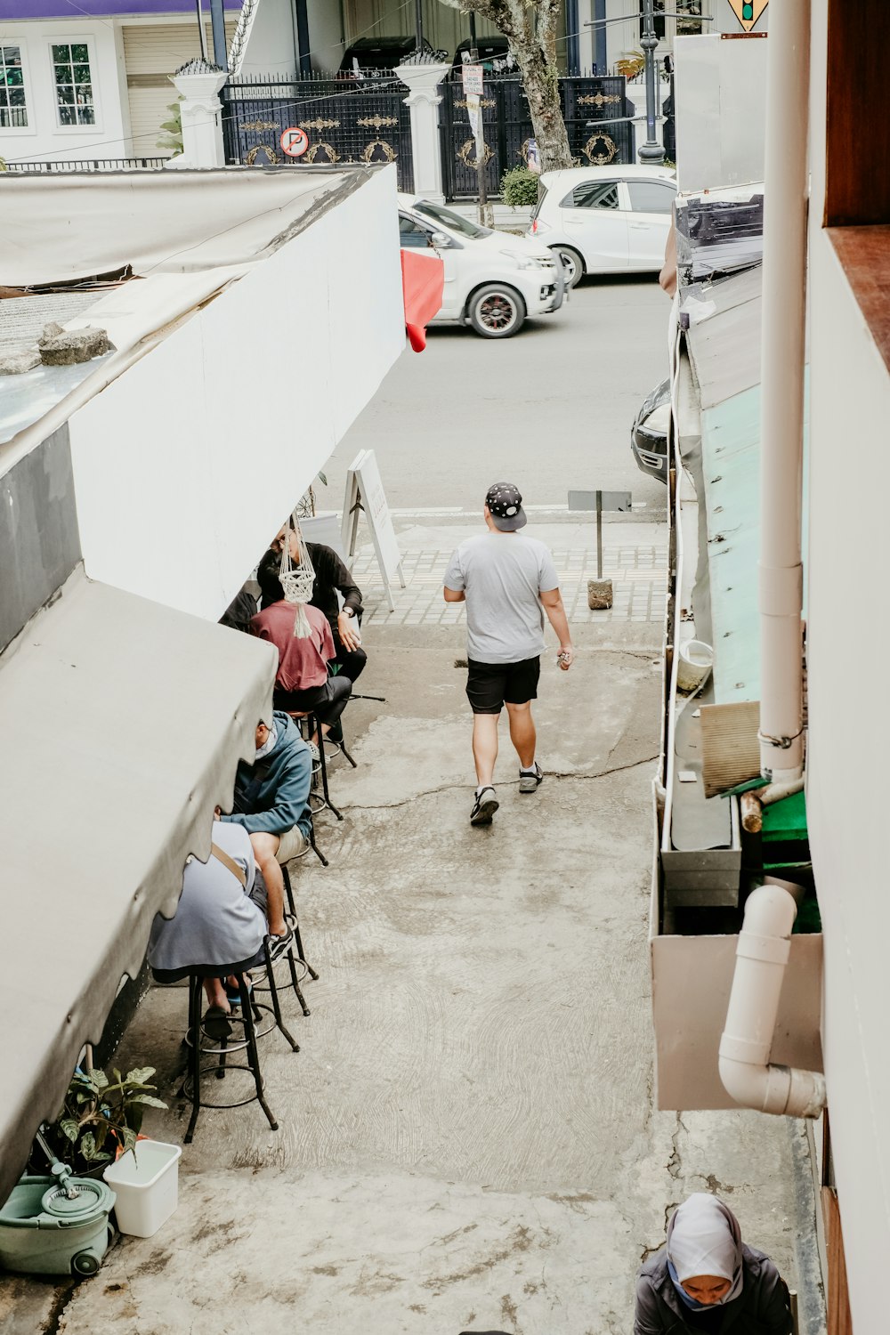 man walking on alley