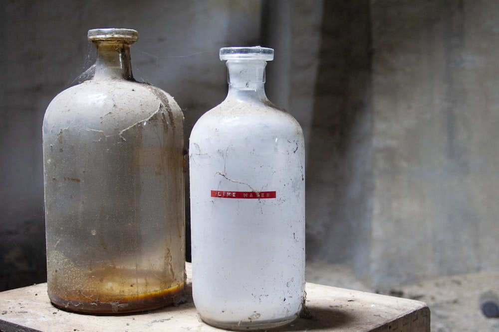 two clear glass bottles