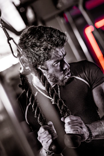 A dynamic shot of a fitness influencer mid-workout, showcasing strength and determination.