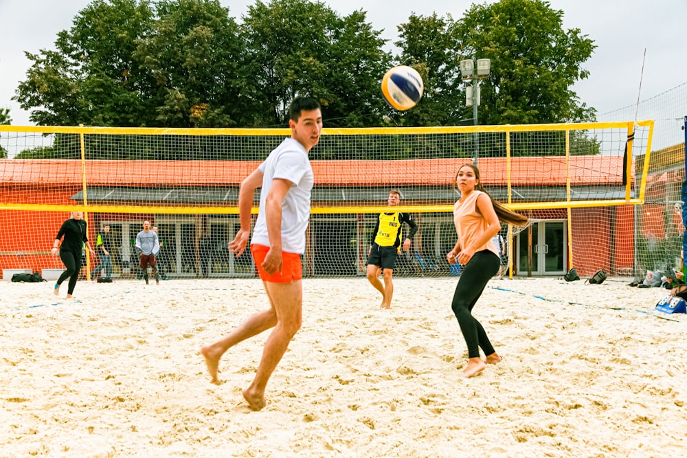 group of people playing volleyball