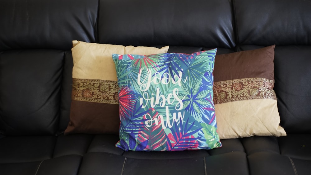 three assorted-color throw pillows