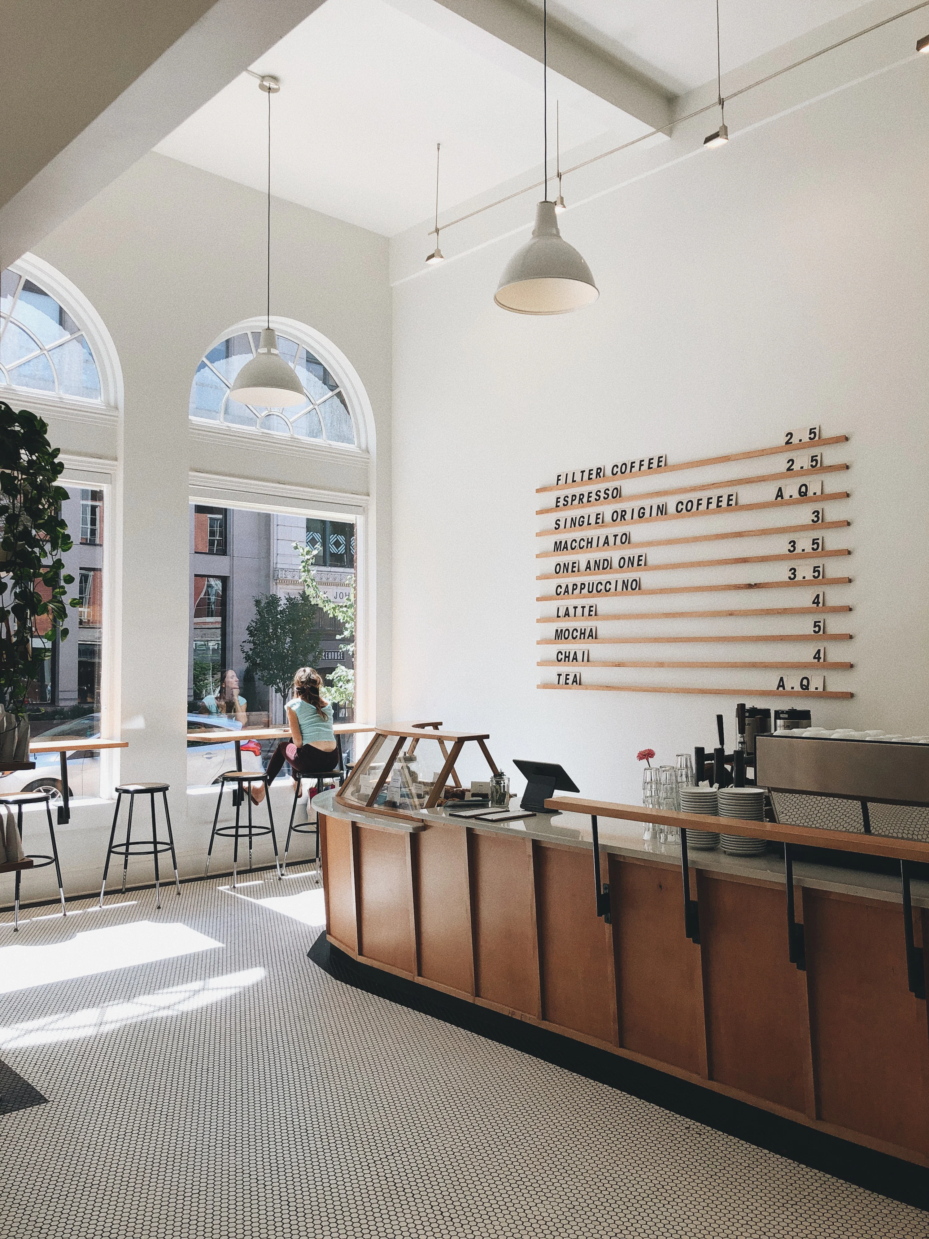 The Ultimate Cozy Fall Solo Date Guide 3 modern coffee shop interior with curved counter