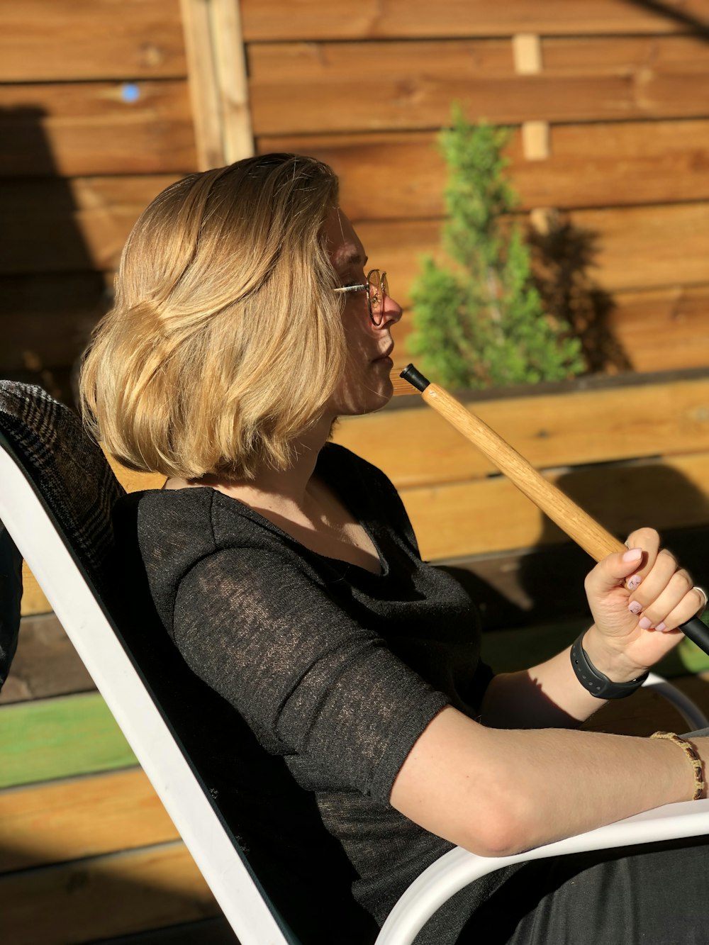 woman sitting on chair at daytime