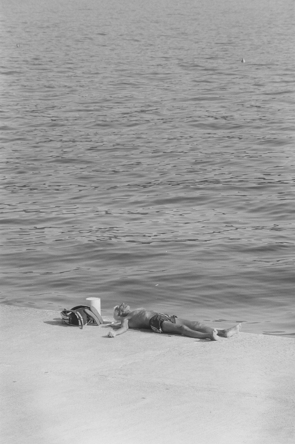 person lying on shore