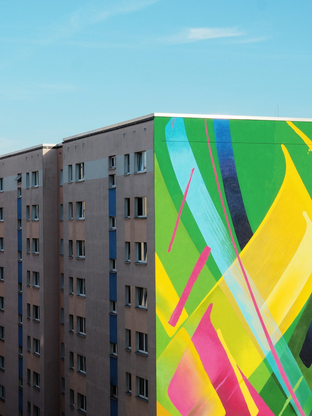 yellow, red, and green high-rise building