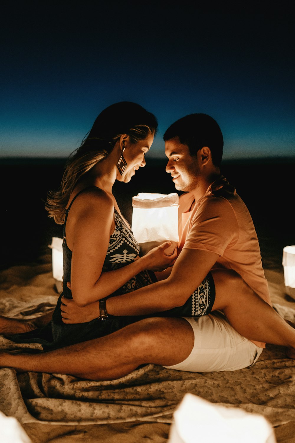 man sitting beside woman