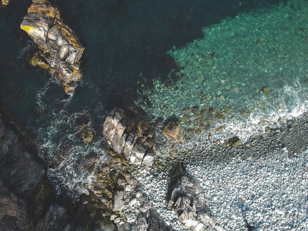 aerial view of rocks by the sea