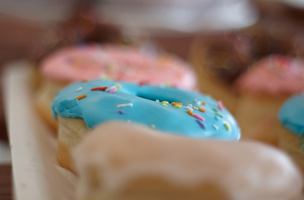 close-up photo of donuts with sprinkles