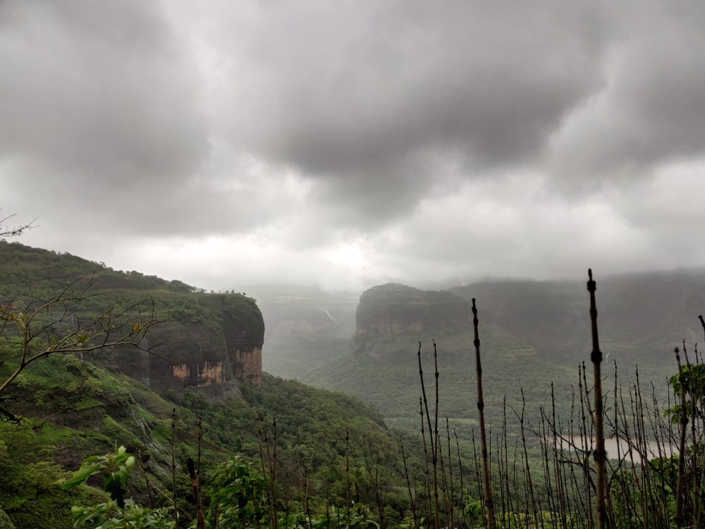 view of mountains under dark clouds