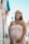 pregnant woman smiling near building during day