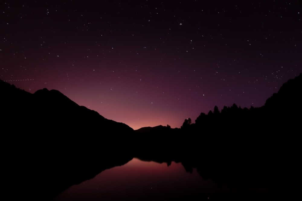 silhouette photo of lake