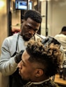 man cutting hair man