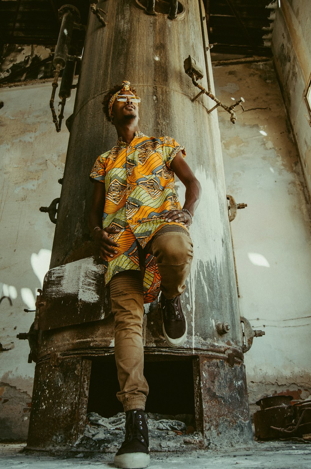 man wearing orange and green leaf graphic shirt