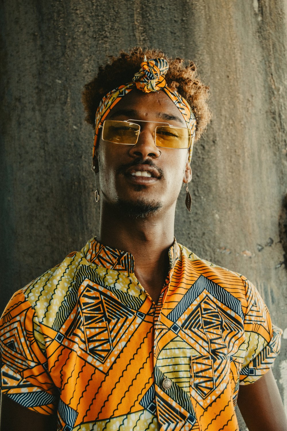 man in yellow button-up collared top