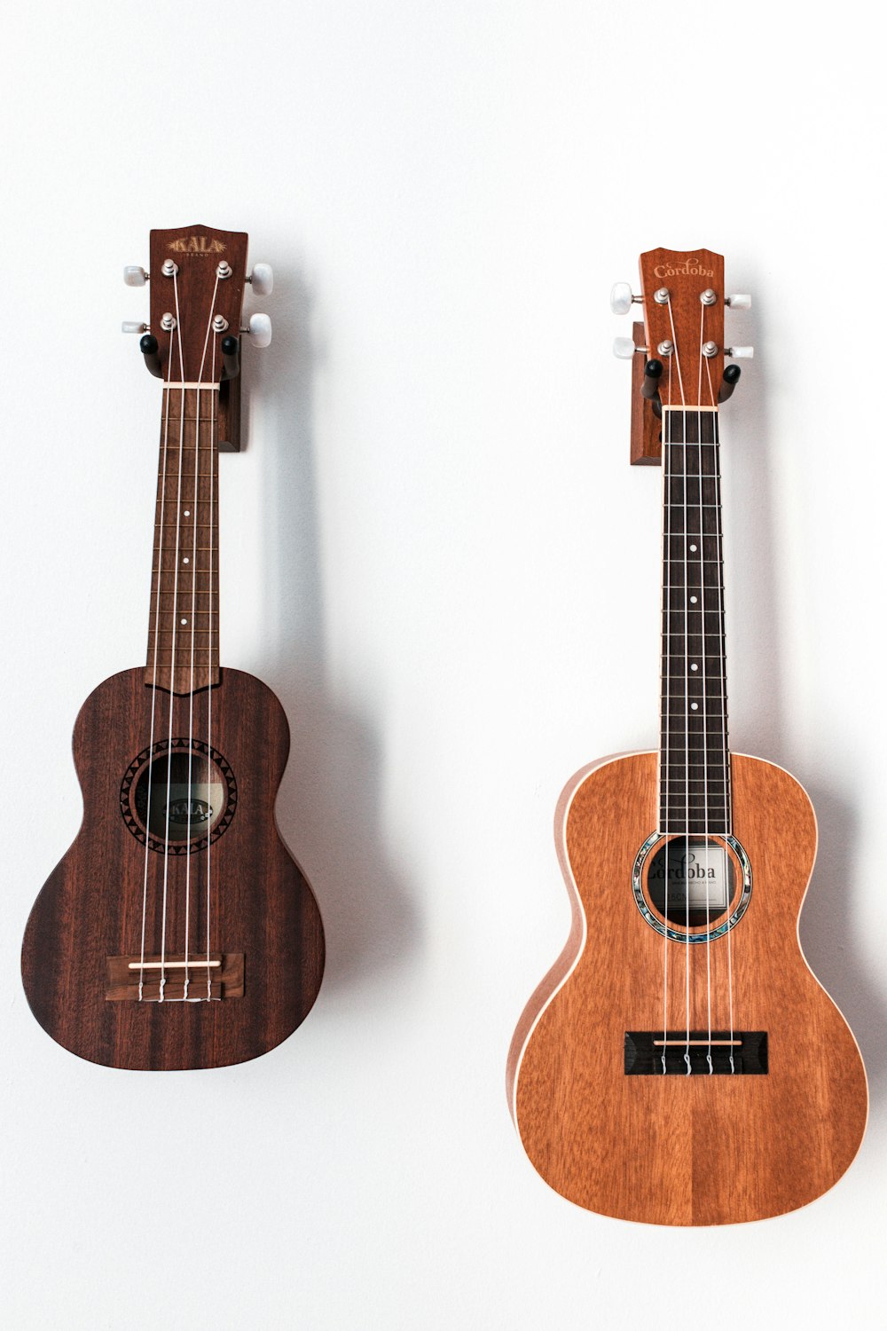 two brown acoustic guitars