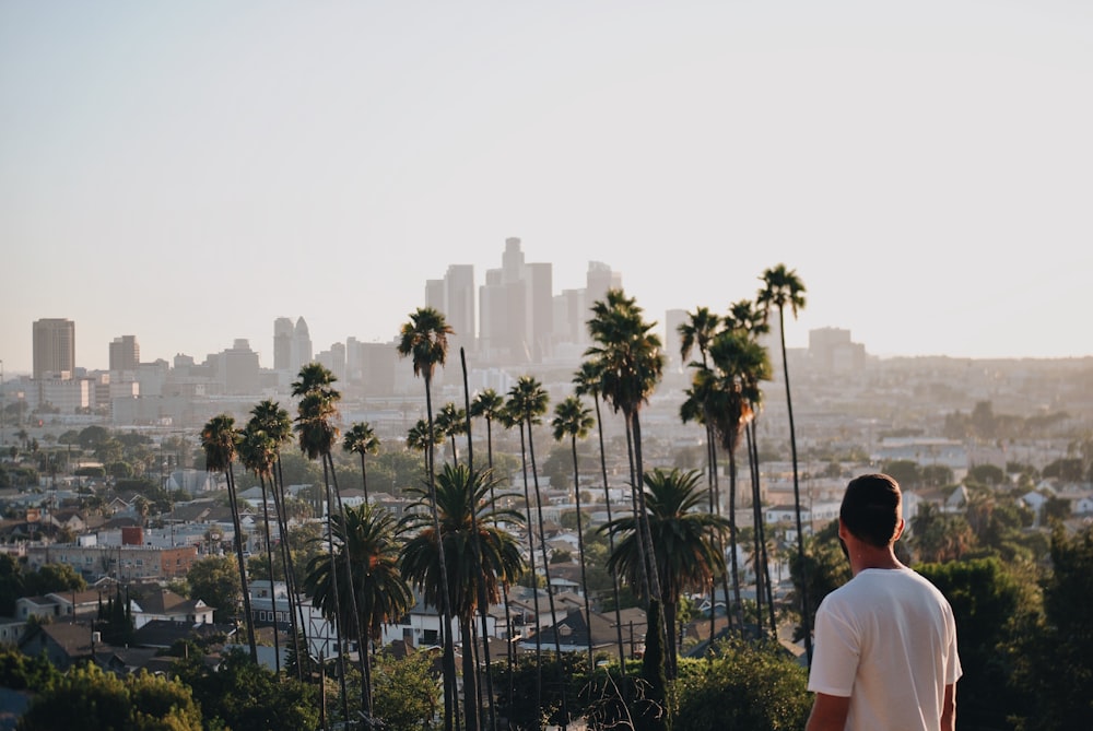 man looks overlooking view of the city