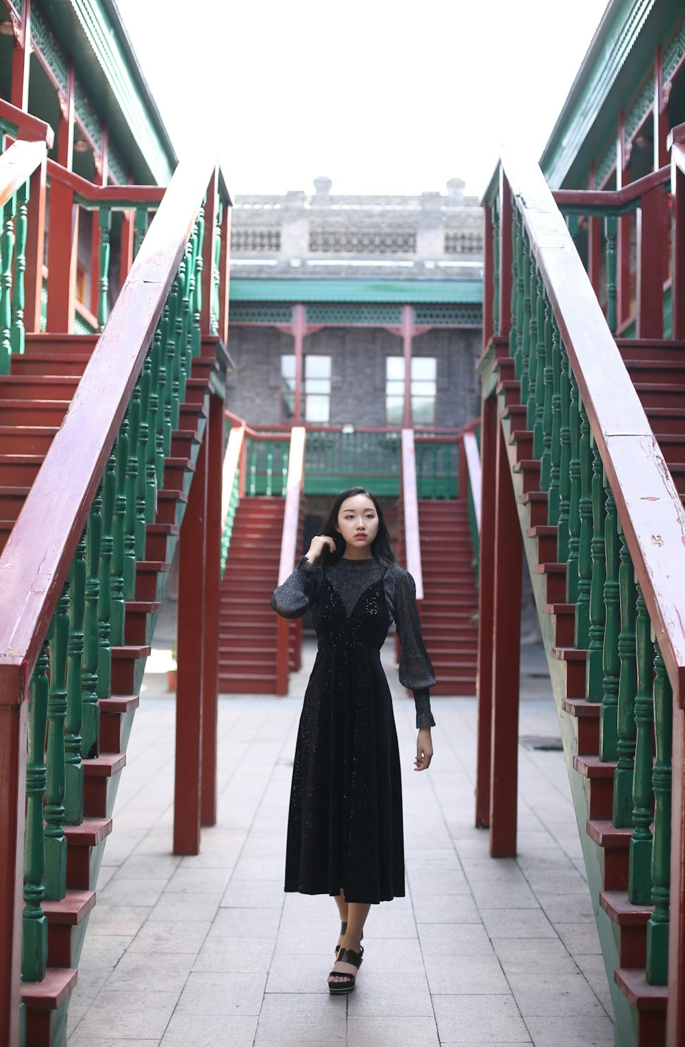 woman standing beside stairs