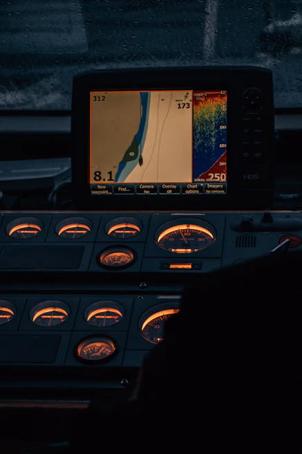Marine Fuel AI dashboard displayed on a tablet held by a technician on deck