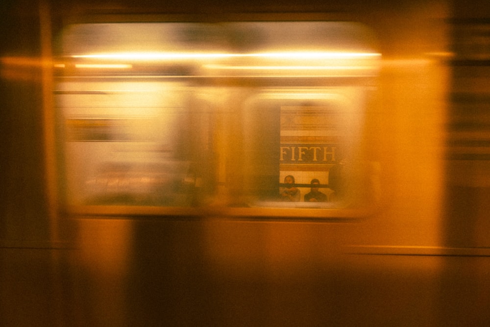 a blurry photo of a train passing by