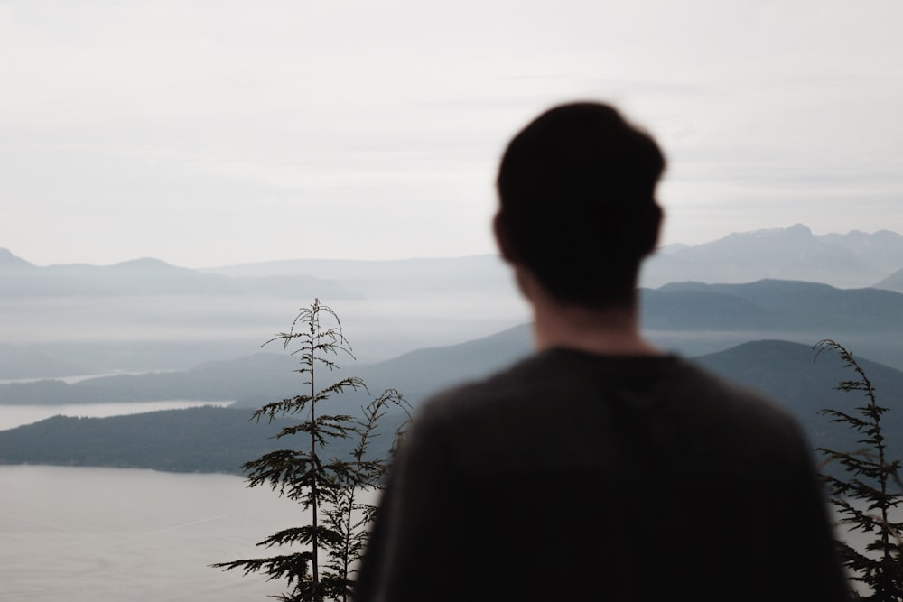 person looking at lake