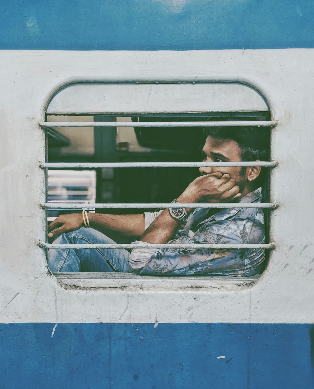 Justin Bieber sitting inside train