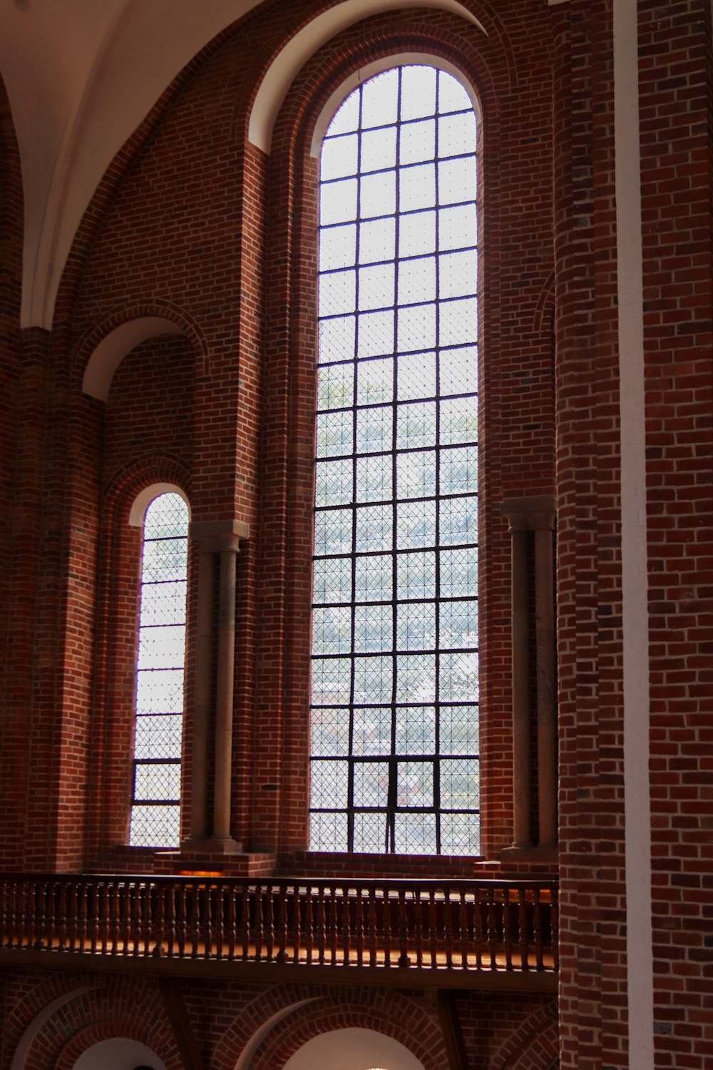 a large window in a brick building with arched windows
