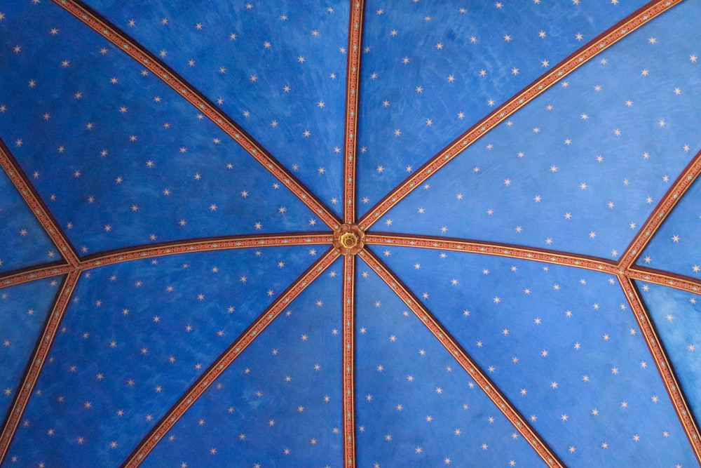 a close up of a blue umbrella with stars on it