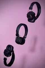 three black cordless headphones