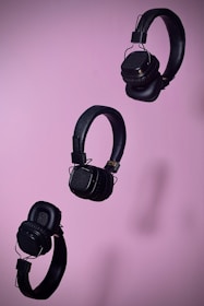 An artistic arrangement of different headphone models on a stylish background.