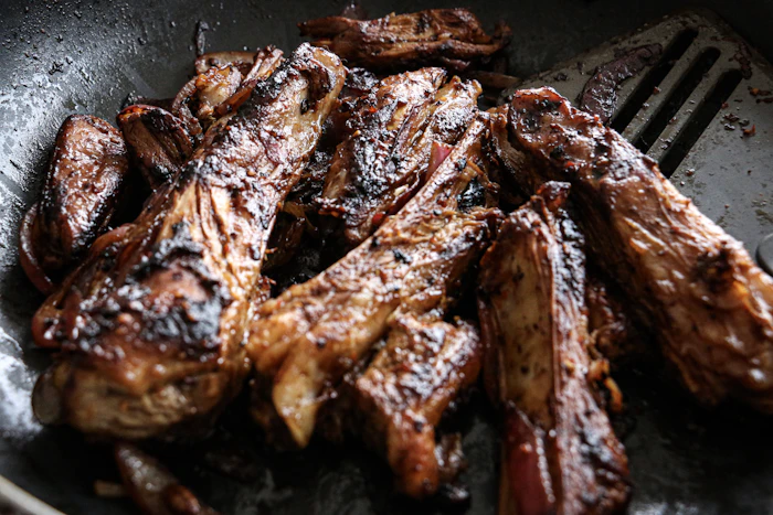 Mbuzi Choma, slow-roasted smoky grilled goat meat