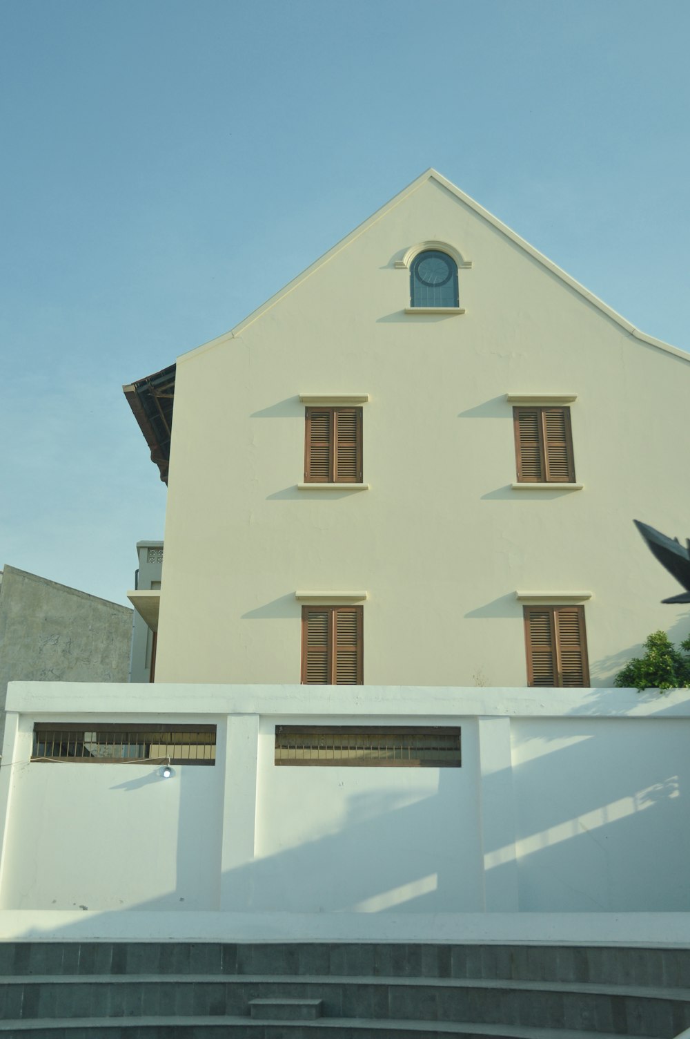 white concrete house under clear sky