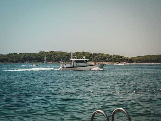 white motorboat on sea in Hvar Croatia