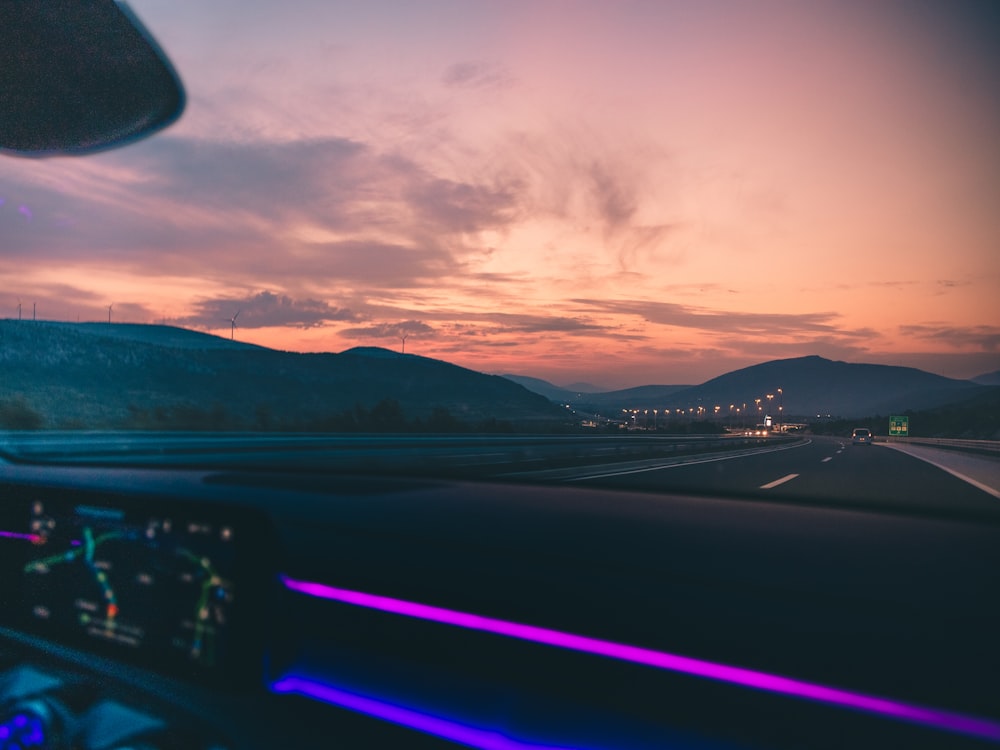 vehicle on road during golden hour