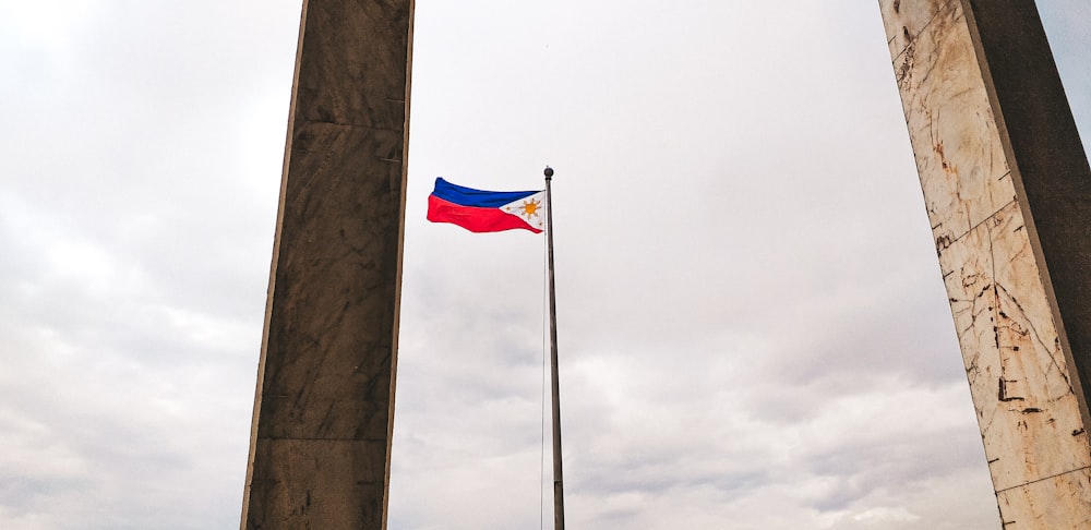 rising flag of Philippines during daytime