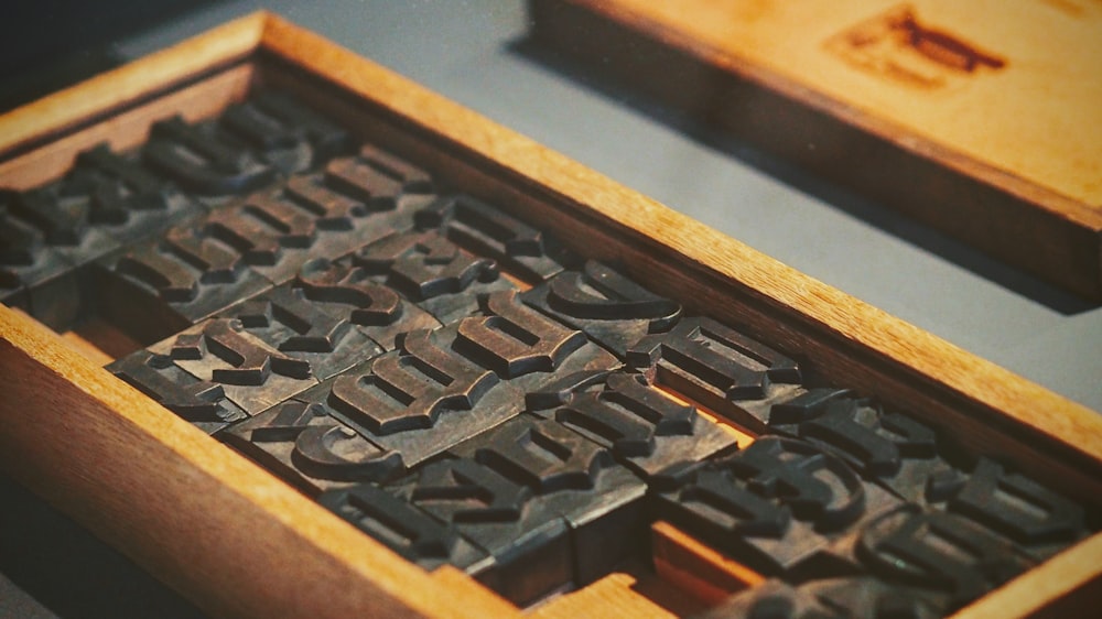metal stamp set inside wooden case