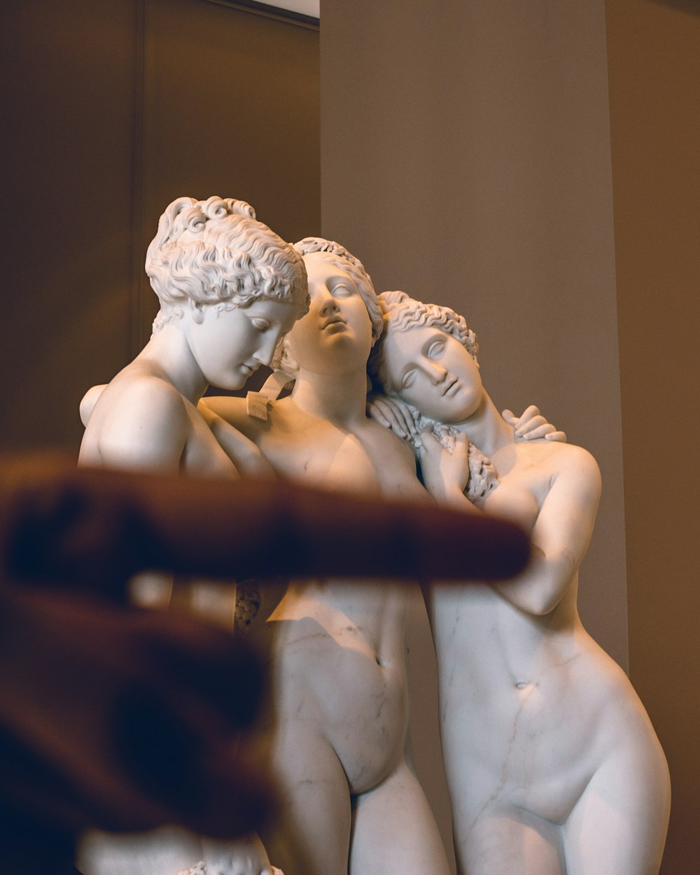 three woman statue