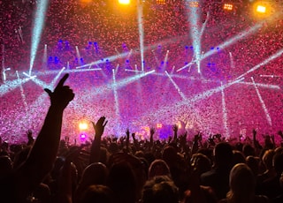 crowd raising their hands