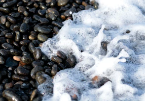 a pile of rocks covered in ice and snow