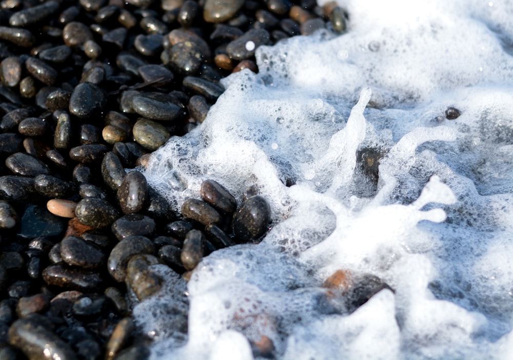 a pile of rocks covered in ice and snow