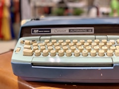 blue and yellow typewriter
