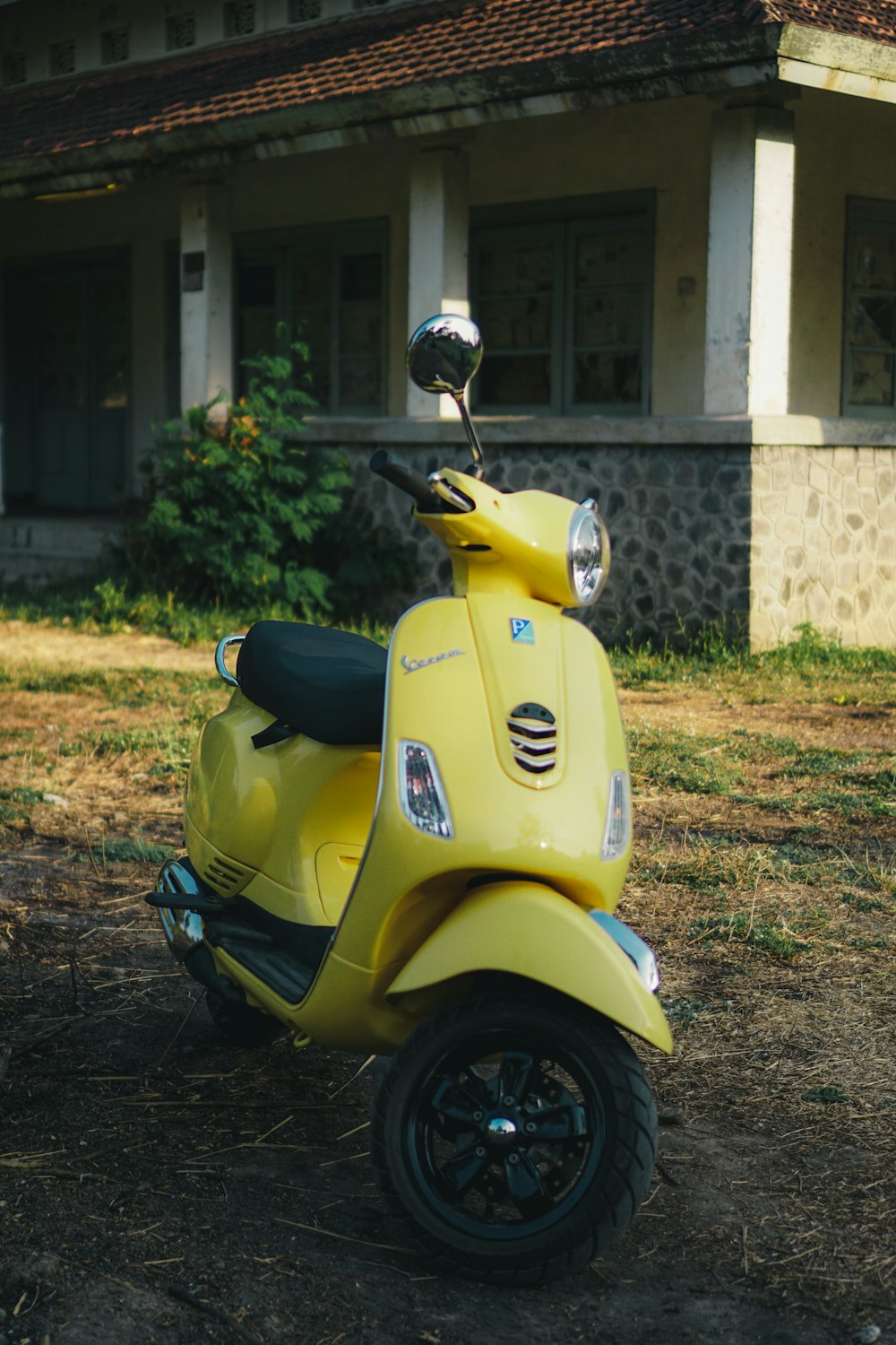 yellow motor scooter during daytime
