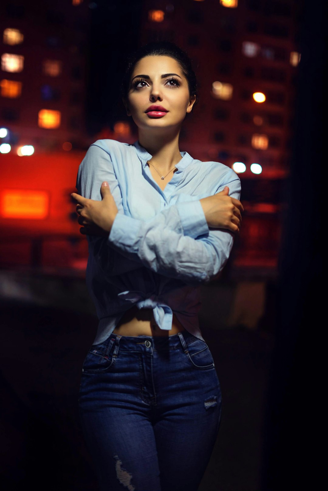 woman wearing blue collared button-up long-sleeved shirt standing