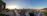 Panoramic view of Bogotá city skyline from an elegant event hall at Club La Aguadora during sunset.