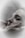 A close-up of a person with closed eyes, being gently cradled by hands which suggest a comforting or soothing gesture. The soft focus and muted colors create a calm, serene atmosphere.